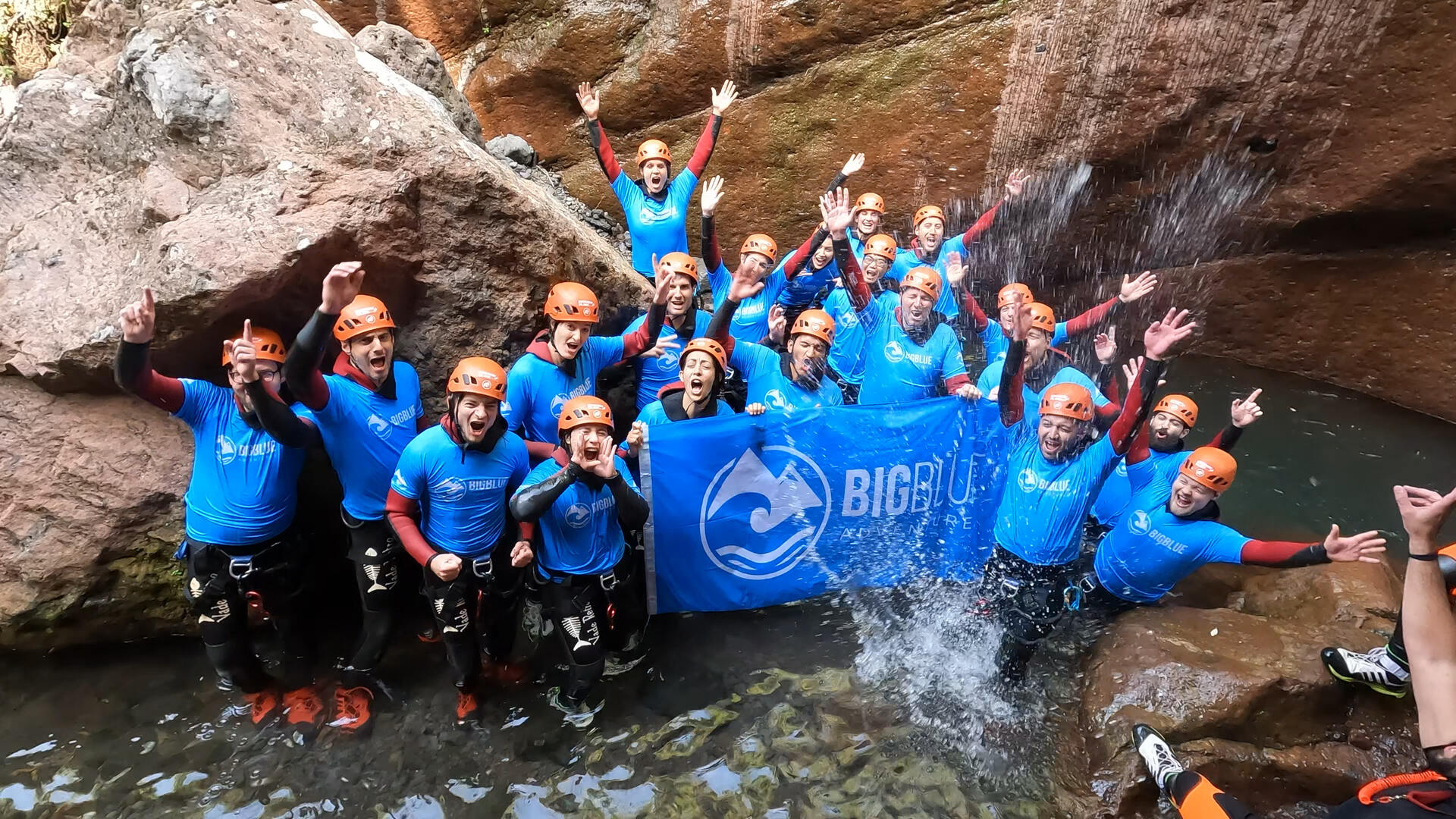 A group on a company offsite going canyoning in Madeira