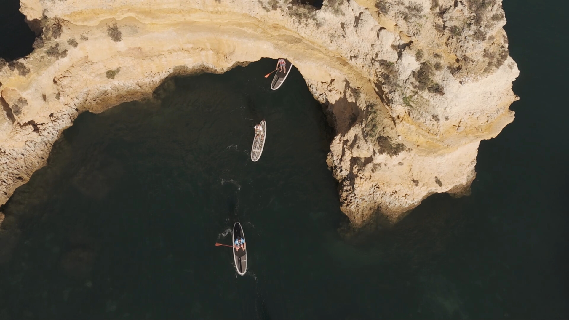 a group paddleboarding in west Algarve, Portugal