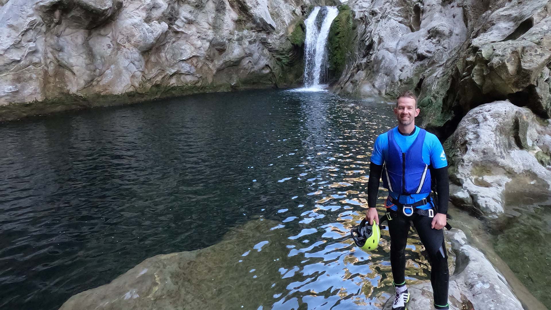 man in front of waterfall while canyoning in Croatia